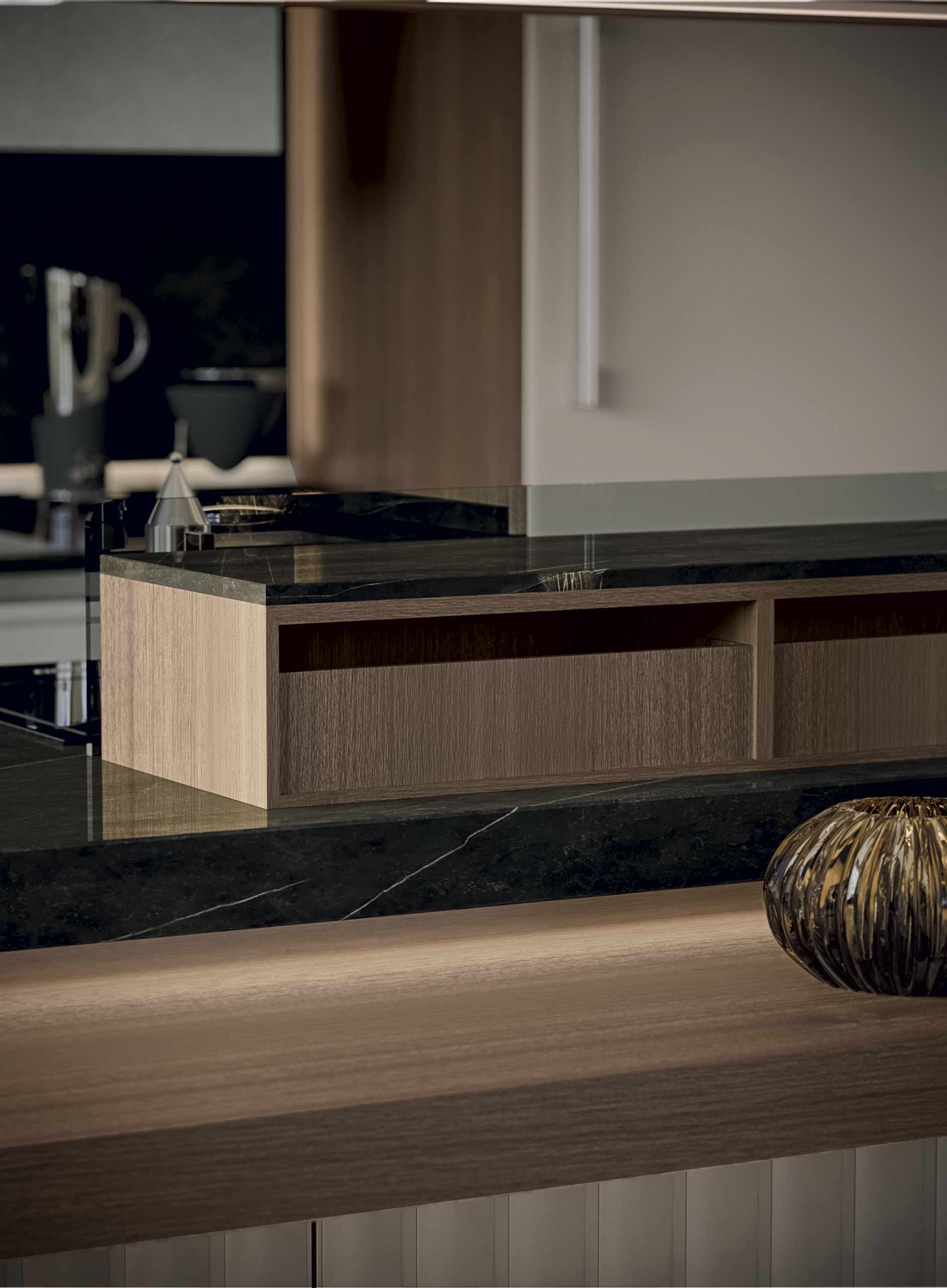 Martini Verona – dettaglio di cucina moderna su misura in noce con piano in materiale scuro e finiture metalliche